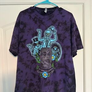 Purple Tie-Dye Glow in the dark Haunted Mansion t-shirt.
